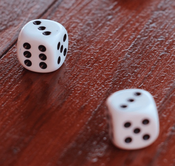 Two white dice to play fun table activity. Photo credit: Lea Bohm