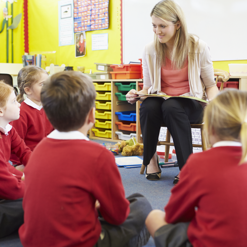 teacher speaking to students coming back to school