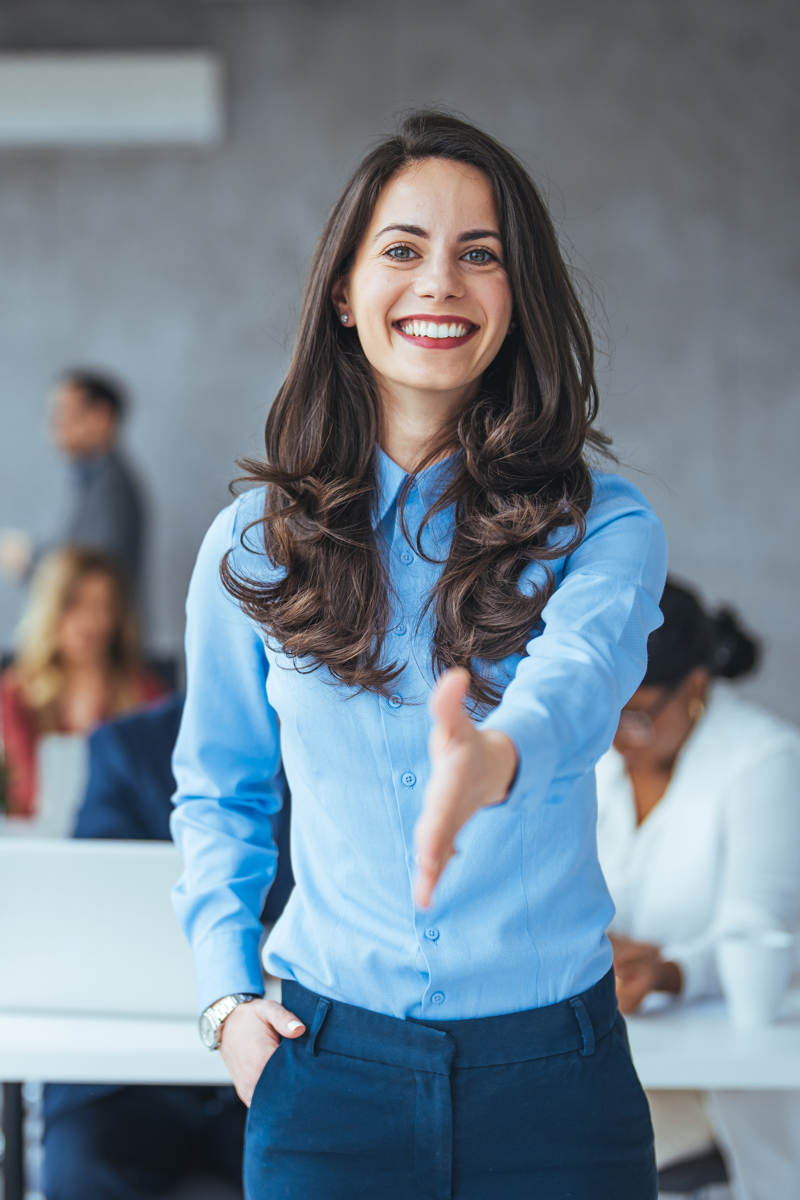 Woman greeting with a handshake