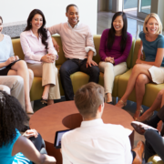 Group sitting down and debriefing