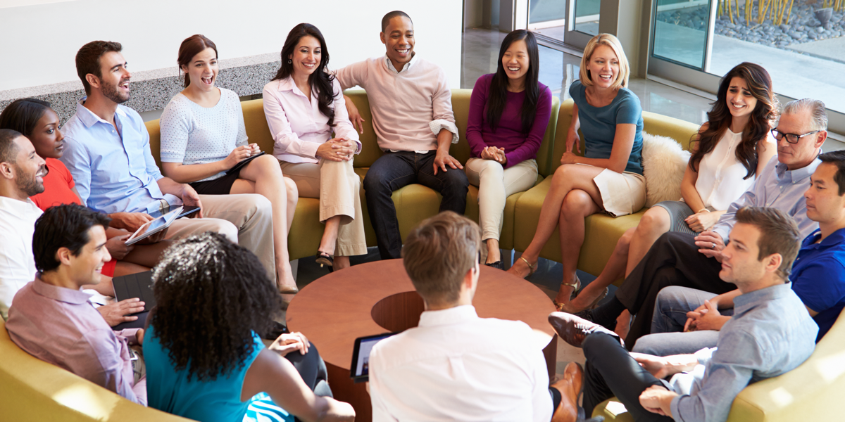 Group sitting down and debriefing