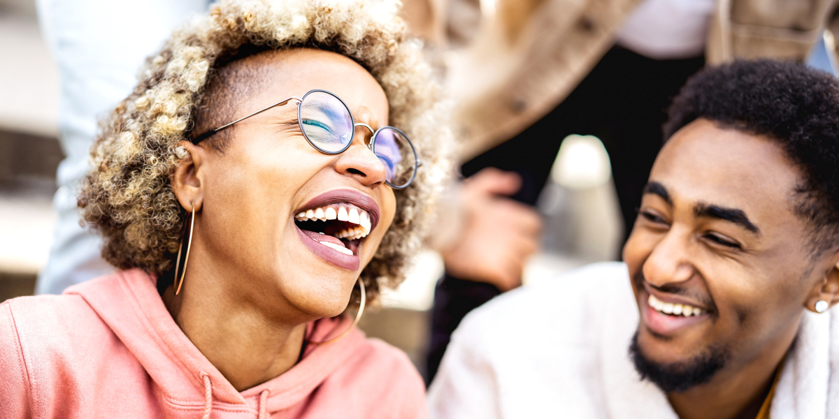 Man and woman laughing during fun group games