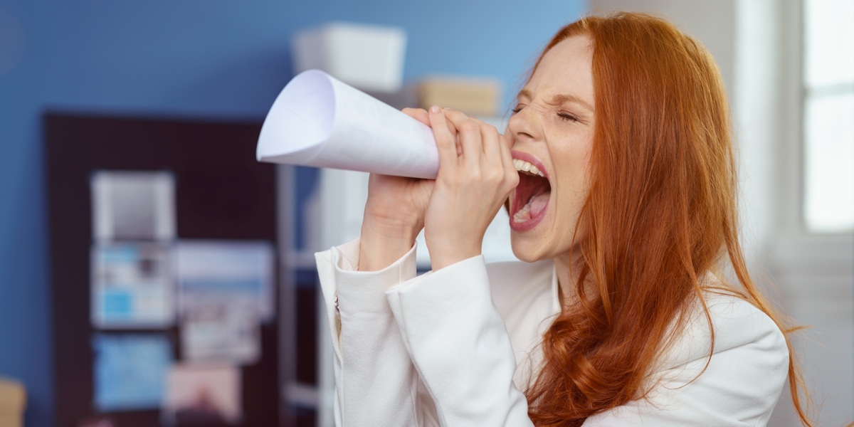 Woman shouting into megaphone