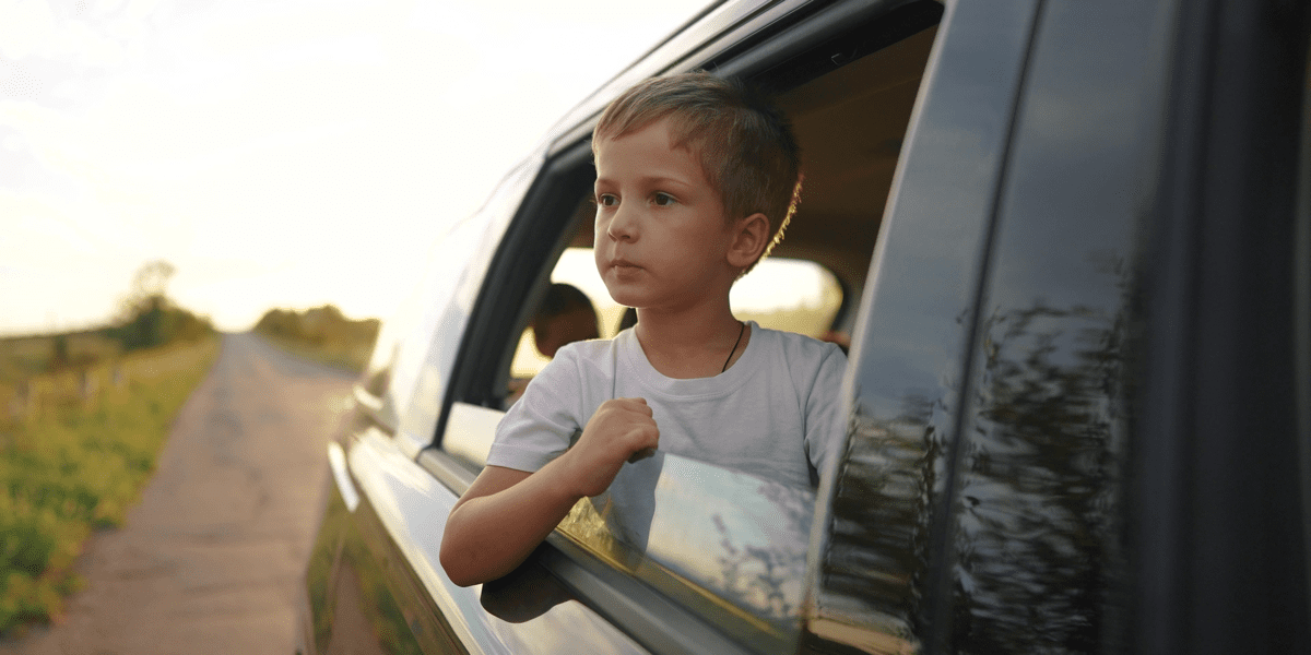 Boy leaning out of window exploring unconscious bias