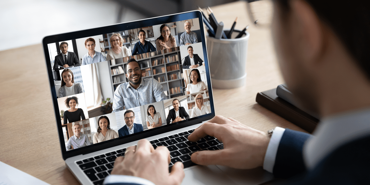 Man typing on keyboard engaged in virtual icebreakers