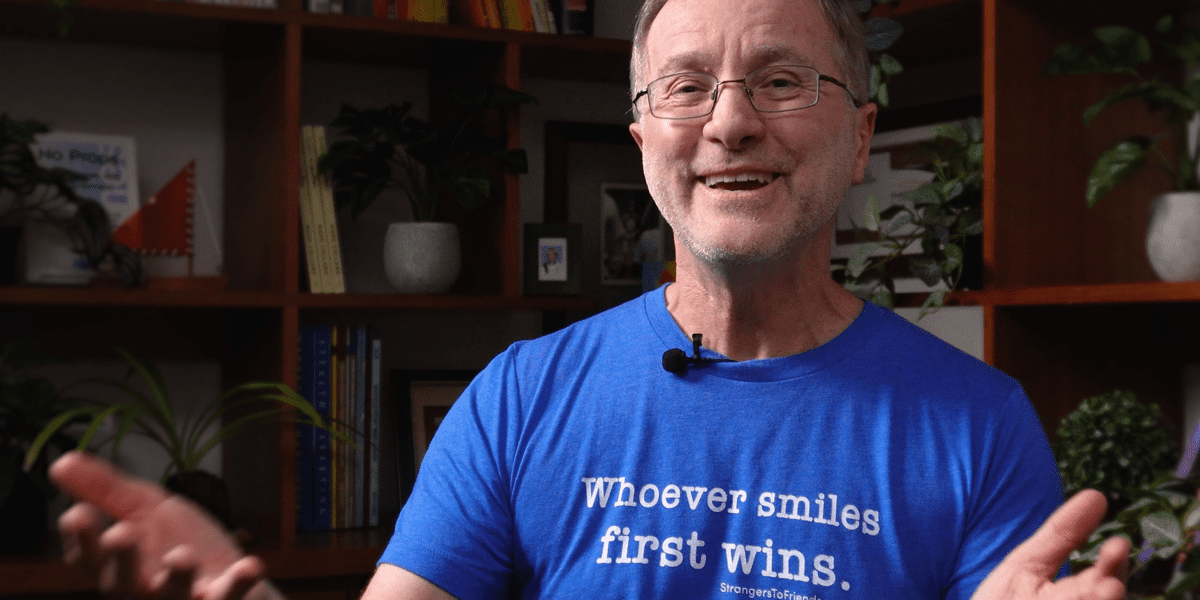 Mark wearing Smiles First Wins tshirt is a great non-threatening icebreaker question