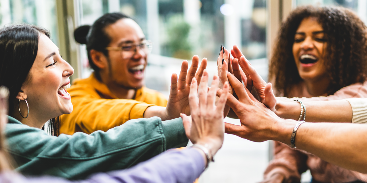 Multiracial group enjoying icebreaker for trust building