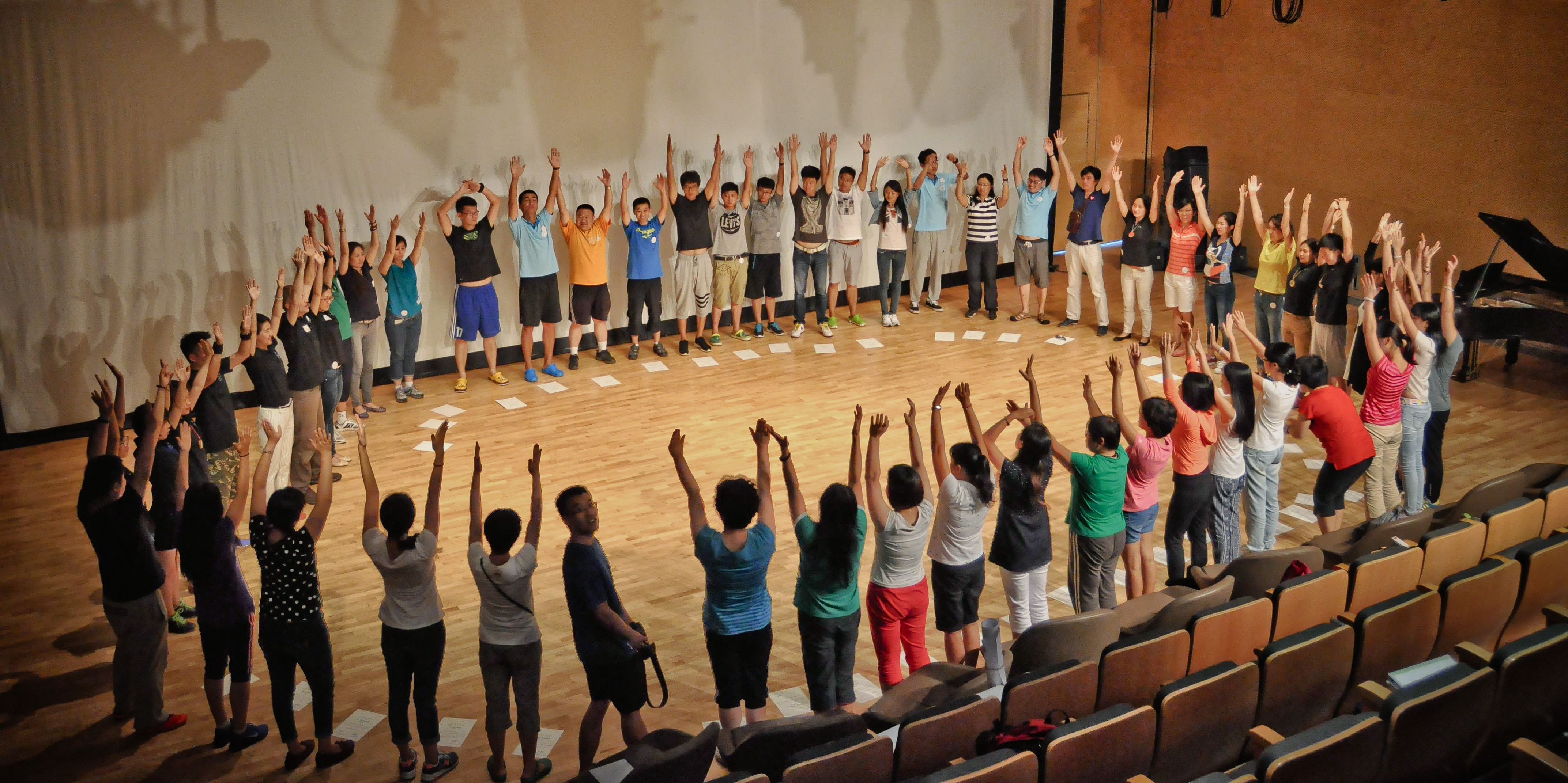 Group in circle engaged in quick and easy team-building games